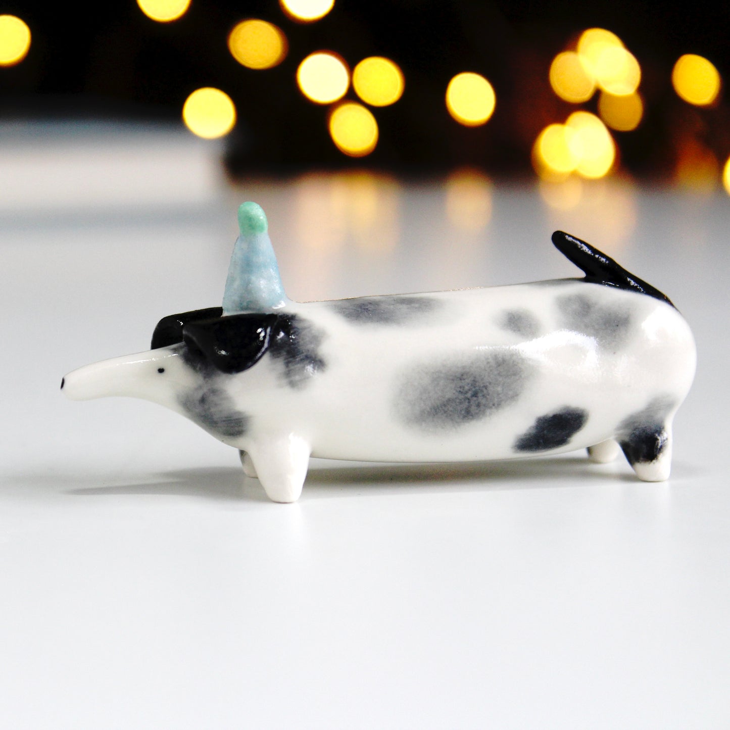 Sausage dog in party hat ornament